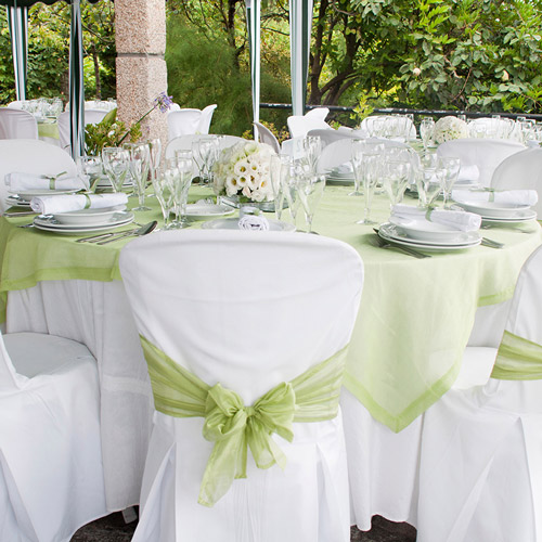 Spring wedding reception table set up. Green is the colour!